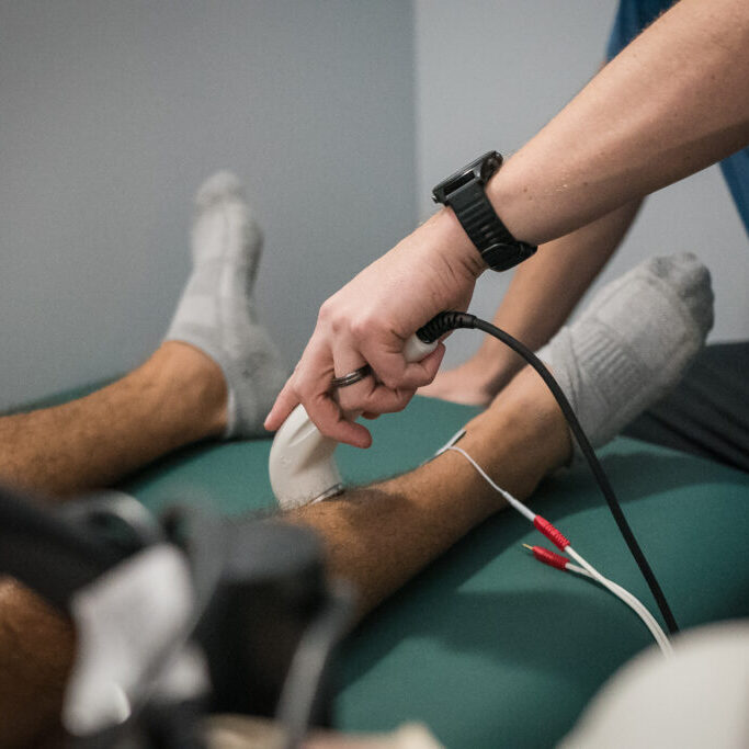 Ultrasound therapy applied to patient’s leg for pain relief