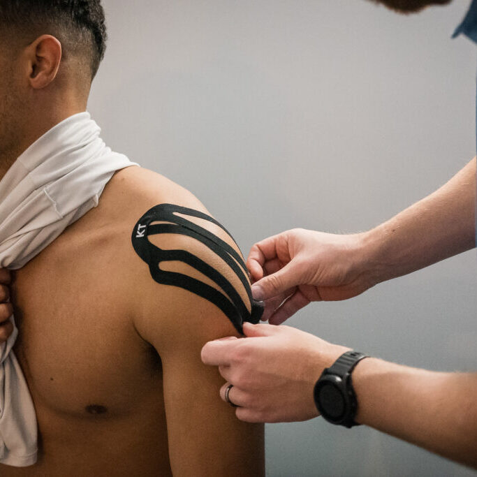 KT Taping to shoulder for support and pain relief